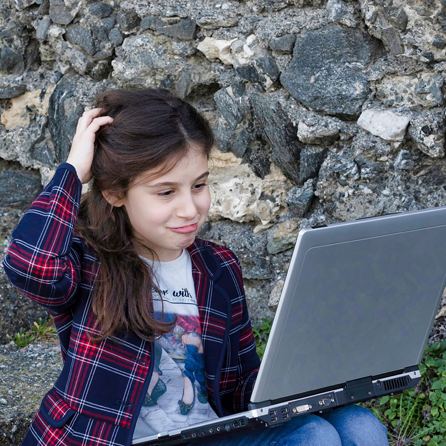 girl looking at laptop